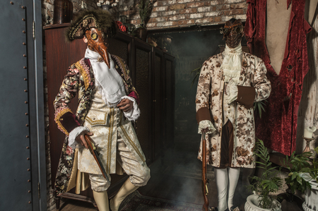 Actors in Steam punk masks and antique costumes indoor.の写真素材