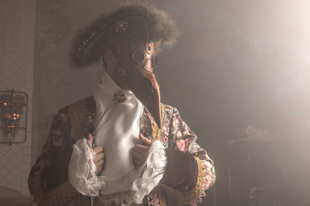 Actor in Steam punk masks and antique costumes indoor.の写真素材