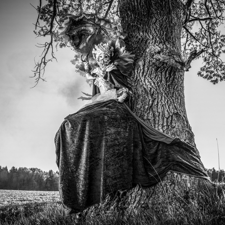 Fairy tale woman on stilts in fantasy stylization. Fine art black-white photo.の写真素材