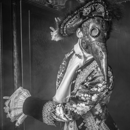 Actor in steam punk masks and antique costumes black-white art photo.の写真素材