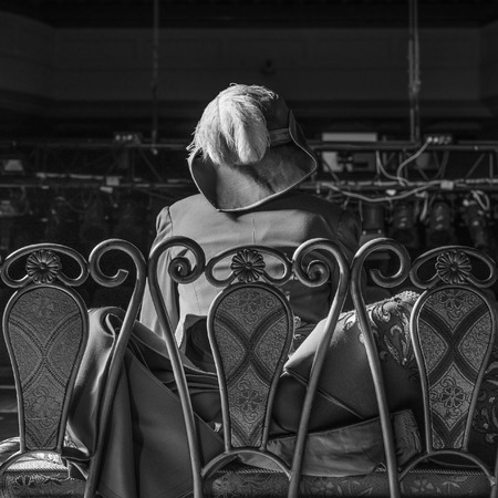 Actor dressed historical costume in interior of old theater. Black-white photo.の写真素材