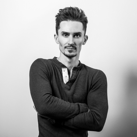 Handsome young elegant man in shirt. Black-white photo.の写真素材