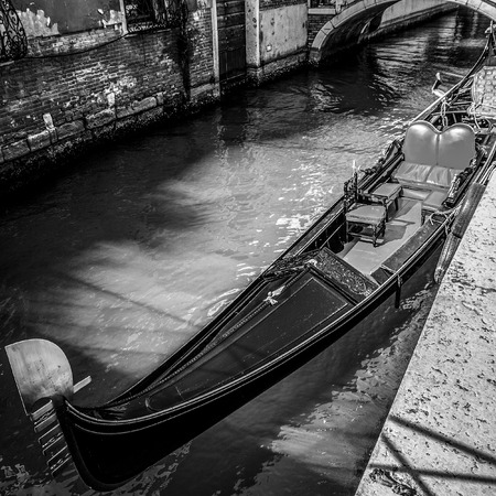 VENICE, ITALY - AUGUST 17, 2016: Traditional gondolas on narrow canal close-up on August 17, 2016 in Venice, Italy.のeditorial素材