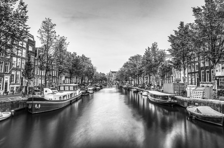 Ð¡anals and embankments of Amsterdam city. Black-white photo.の写真素材