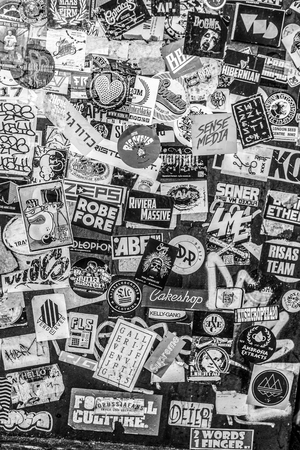 AMSTERDAM, NETHERLANDS - JANUARY 17, 2017: Street wall covered numerous multicolored stickers on January 17 in Amsterdam, The Netherlands.のeditorial素材