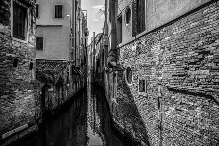VENICE, ITALY - AUGUST 19, 2016: Famous architectural monuments and facades of old medieval buildings black-white photo. on August 19, 2016 in Venice, Italy.のeditorial素材