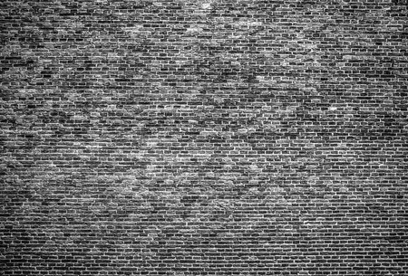 Old stone wall background. Black-white photo.