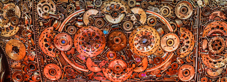 Old metal colorful background made of recycled metal items.