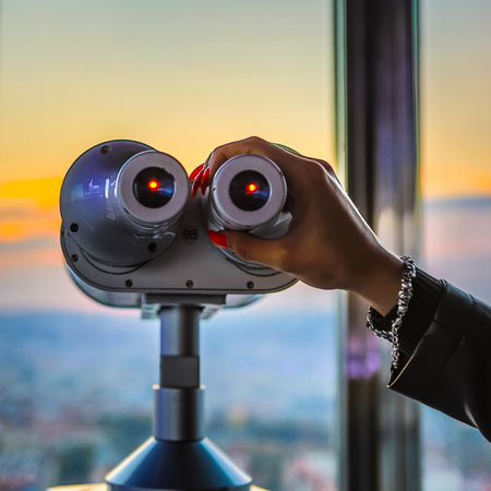 Classic form telescope to observe top view landscape.