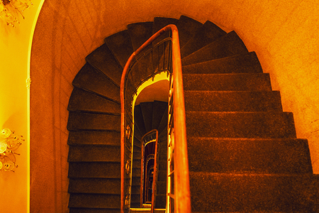 Ancient stairs in porches of European vintage buildings.の写真素材