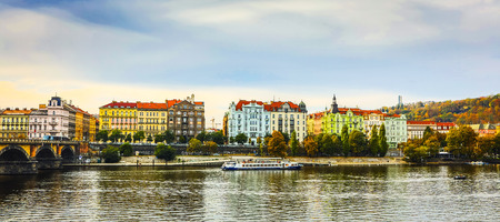 City view from bridge and traditional Czech architecture of antique Prague buildings at autumn evening.のeditorial素材