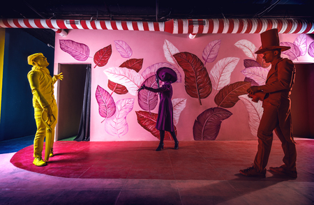Group of stylized fantasy actors in scenic make-up and bright colored background.の写真素材