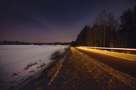 Night landscape of winter road.の写真素材