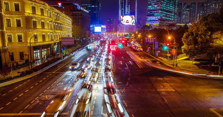 SHANGHAI, Ð¡HINA - APRIL 03, 2019: Modern central streets of Shanghai and high-rise buildings at night time.のeditorial素材