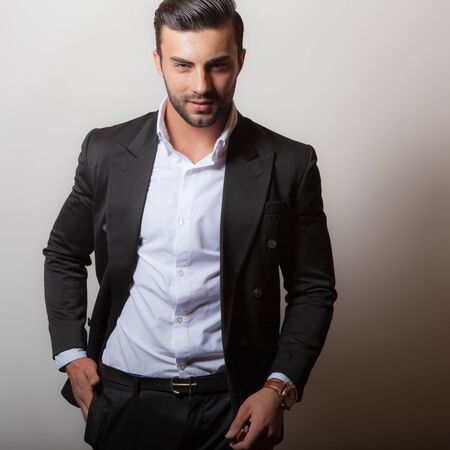 Handsome young elegant man studio portrait.の写真素材