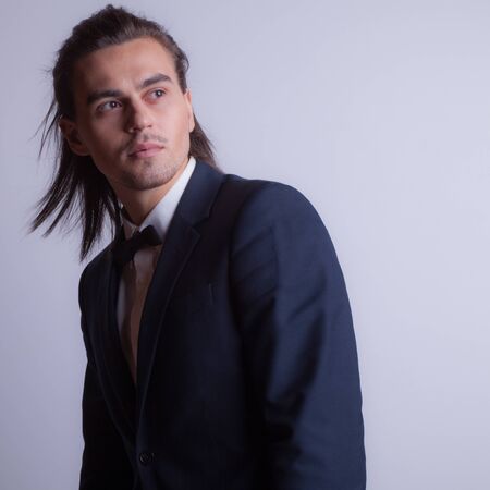 Handsome young elegant man studio portrait.の写真素材