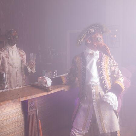 Actors in Steam punk masks and antique costumes indoor.の写真素材