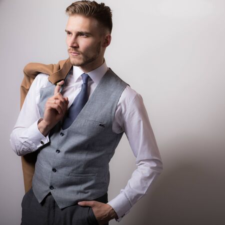Handsome young elegant man studio portrait.の写真素材