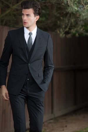 Young elegant handsome man posing outside.の写真素材