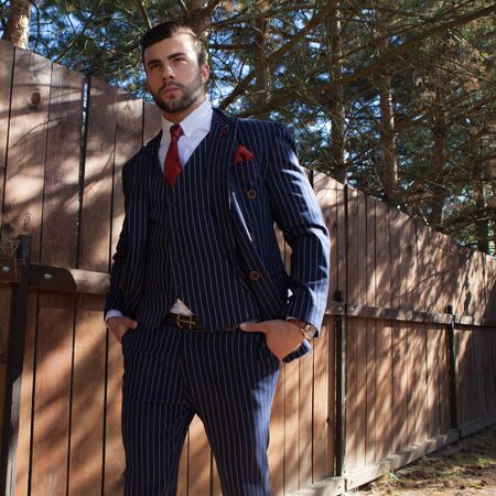 Young elegant handsome man posing outside.の写真素材