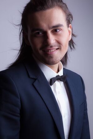 Handsome young elegant man studio portrait.の写真素材