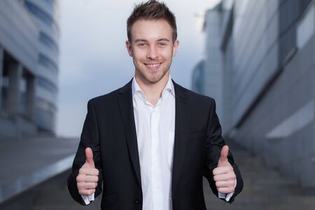 Young elegant handsome man posing outside.の写真素材