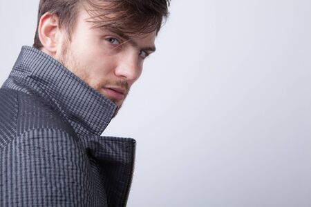 Handsome young elegant man studio portrait.の写真素材