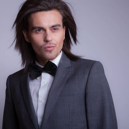 Handsome young elegant man studio portrait.の写真素材