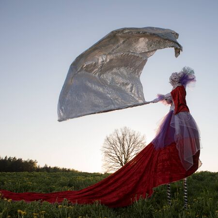 Fairy tale woman on stilts in bright fantasy stylization.の写真素材