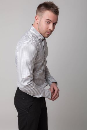 Handsome young elegant man studio portrait.の写真素材