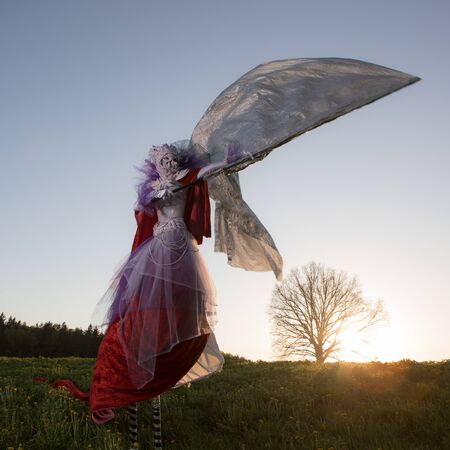 Fairy tale woman on stilts in bright fantasy stylization.の写真素材
