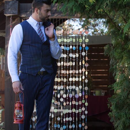 Young elegant handsome man posing outside.の写真素材