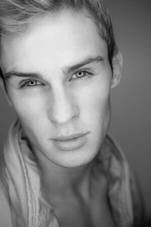 Handsome young elegant man studio portrait.の写真素材