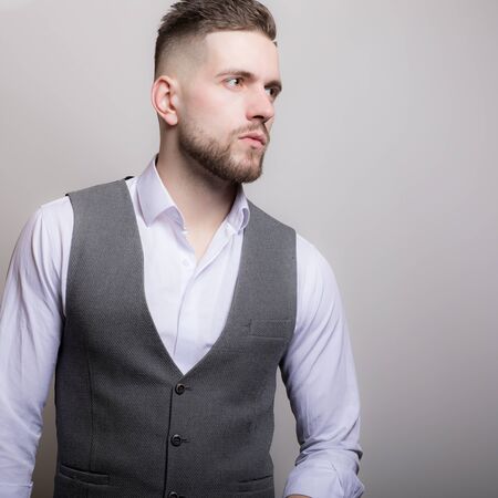 Handsome young elegant man studio portrait.の写真素材