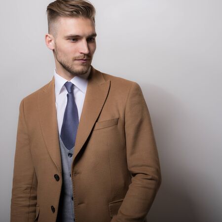 Handsome young elegant man studio portrait.の写真素材