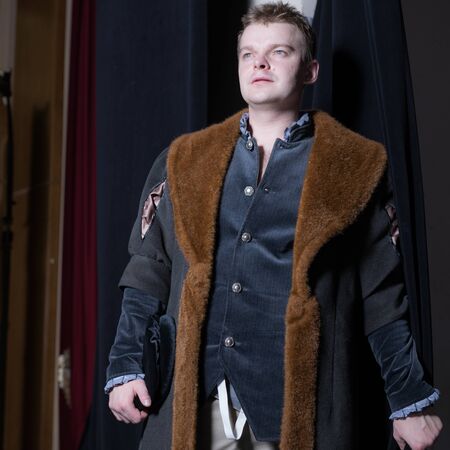 Actor dressed historical costume in interior of old theater.の写真素材