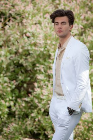 Young elegant handsome man posing outside.の写真素材