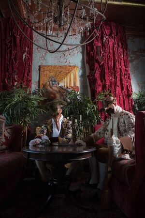 Actors in Steam punk masks and antique costumes indoor.