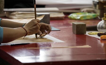 BEIJING, ?HINA - JUNE 01, 2019: Traditional Chinese book and calligraphy restorer laboratory. Master...