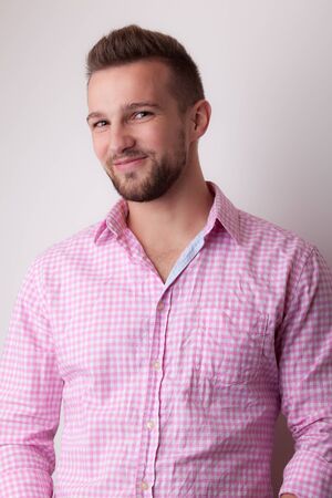Handsome young elegant man studio portrait close-up.の写真素材