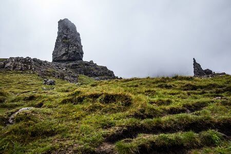 Old Man of Storr on the Isle of Skye in Scotland. Mountain landscape with foggy clouds.の写真素材