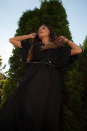 Portrait of beautiful young girl in summer garden.の写真素材