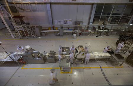 BEIJING, Ð¡HINA - JUNE 01, 2019: Industrial production of bread baking factory in China.のeditorial素材