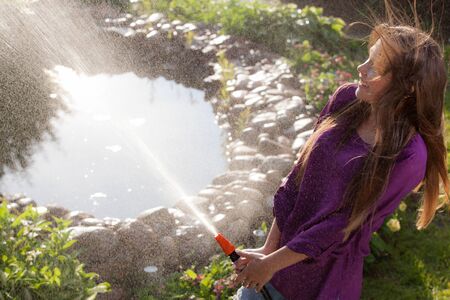 Portrait of beautiful young girl in summer garden.の写真素材