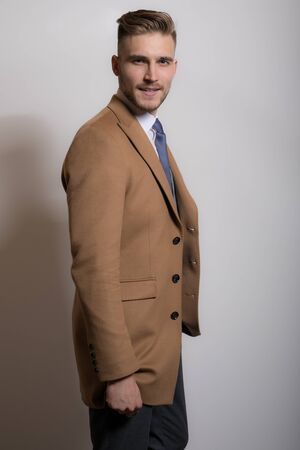 Handsome young elegant man studio portrait close-up.の写真素材