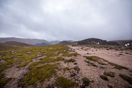 Beautiful mountains landscape of Scotland nature with beautiful evening cloudy sky.の写真素材