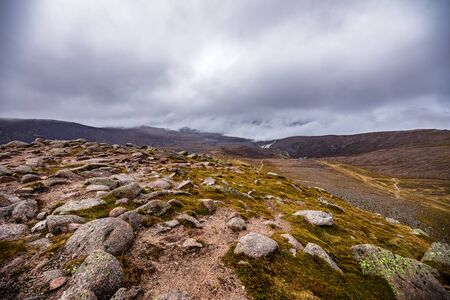 Beautiful mountains landscape of Scotland nature with beautiful evening cloudy skyの写真素材