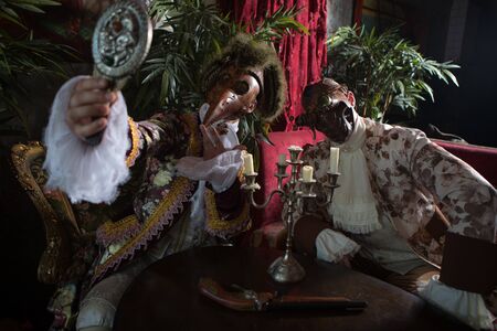 Actors in Steam punk masks and antique costumes indoor.の写真素材
