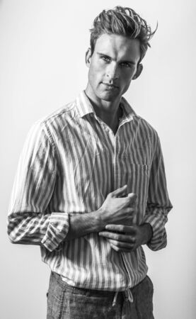 Elegant young handsome man in classic shirt. Black-white portrait.の写真素材