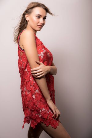 Young beautiful stylish girl posing in studio.の写真素材